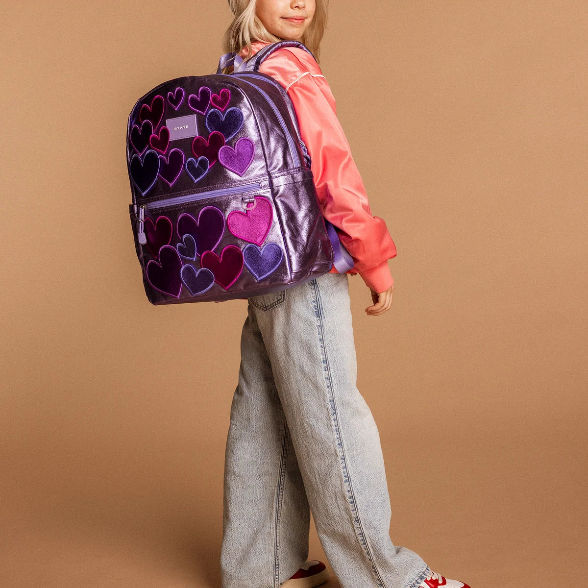 Mochila Kane de doble bolsillo morada con estrellas de colores