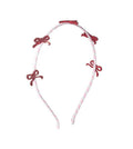 Diadema con lazo brillante y rayas de caramelo