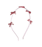 Diadema con lazo brillante y rayas de caramelo